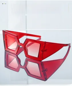 Detail of red translucent geometric sunglasses with wide temples and jelly texture