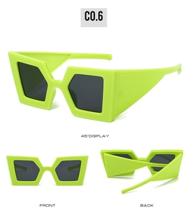 Neon green oversized geometric sunglasses with wide temples and dark grey lenses