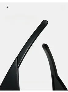 Detail of ergonomic curved mirror legs on high-gloss black oversized sunglasses