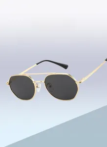 Close-up of geometric gold metal frame sunglasses with double bridge and polarized lenses