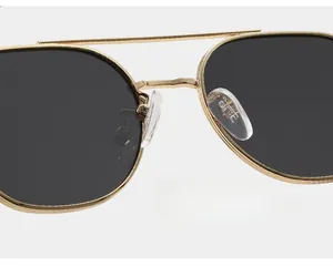 Close-up of double-bridge metal sunglasses with soft silicone nose pads for comfort