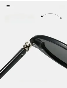 Macro detail of high-quality silver metal hinge on minimalist black oval sunglasses
