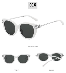 Detail view of white cat-eye sunglasses featuring silver metal chain decorative temples