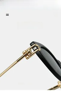 Macro view of golden spherical hinge on black cat-eye sunglasses for a lightweight design