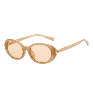 Champagne oval retro sunglasses with translucent resin frames and gold chain detail