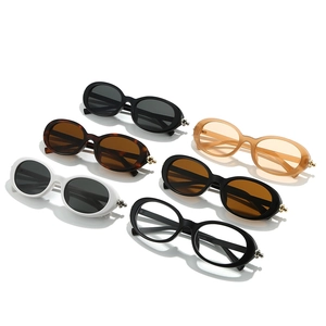 Collection of retro oval sunglasses in multiple colors with metallic ball accents