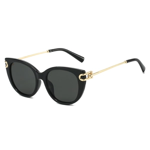 Classic black cat-eye sunglasses with gold metal temples and U-shaped accents