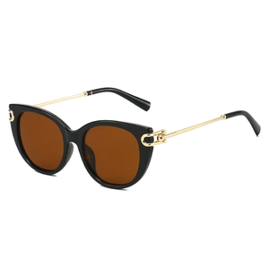 Classic cat-eye sunglasses with black frames, brown lenses, and gold metal temples