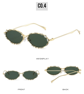 Vistas detalladas de gafas de sol ovaladas doradas con brillantes diamantes de imitación