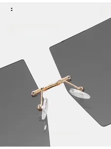 Detail of adjustable silicone nose pads and golden metal bridge on oversized sunglasses