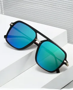 Detail of premium square aviator sunglasses featuring gradient lenses and gold metal accents