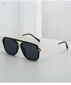 Detail view of aviator sunglasses with gold metal temples and high quality black frame