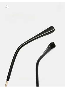 Macro detail of curved ergonomic temple with polarized marking and brand logo on black sunglasses