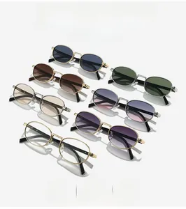 Flat lay of retro oval metal sunglasses in seven vibrant lens colors with side shadows