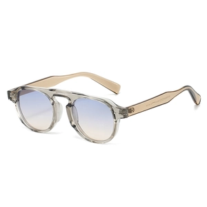 Retro round TR90 sunglasses with transparent grey frame and gradient blue orange lenses