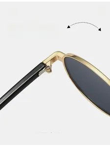 Macro detail of durable gold metal hinge and high-quality texture on oval sunglasses