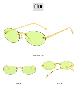 Macro detail of rimless oval sunglasses with lime green lenses and golden metal frame