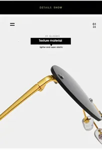 Detail view of gold metal hinge and grey lens on rimless oval sunglasses