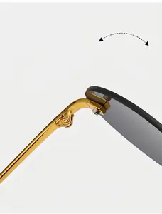 Macro view of durable metal hinge on rimless sunglasses with gold-tone finish