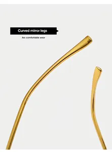 Macro detail of curved gold metal mirror legs on these rimless oval sunglasses