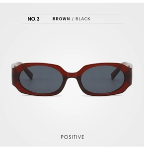 Front view of retro oval sunglasses with translucent amber frame and dark gray lenses