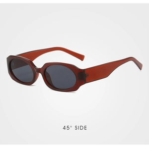 Retro amber oval sunglasses with dark lenses shown from a professional 45-degree side angle