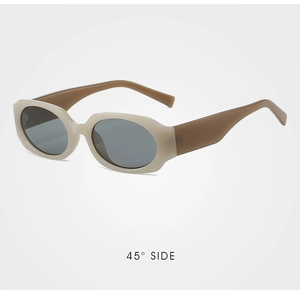 Detailed 45-degree side view of vintage oval sunglasses with beige frames and dark temples