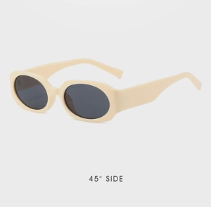 Detailed 45-degree side view of retro oval sunglasses with thick beige frames and dark lenses