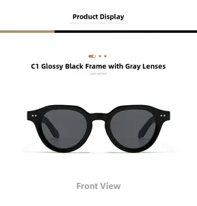 Detailed front view of round black sunglasses with silver rivet accents and grey lenses