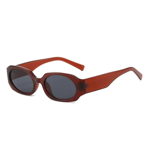 Retro oval sunglasses with red-brown translucent frame and dark grey lenses for street style