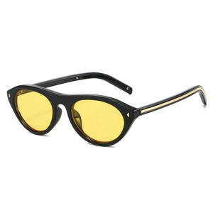 Modern cat-eye sunglasses with black frame, yellow lenses, and metallic rivet accents