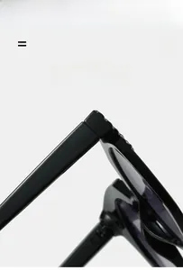 Close-up of durable metal hinge on sleek black oval sunglasses with high-elastic frame