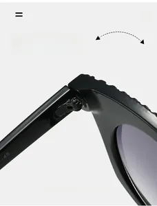 Close-up of a durable silver metal hinge on thick black oval hip-hop sunglasses