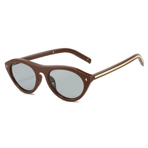 Retro oval cat eye sunglasses with dark brown frame and golden metal accents