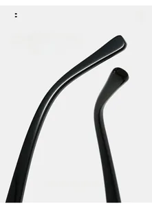 Close-up of black glossy ergonomic curved sunglasses legs for comfortable wearing experience