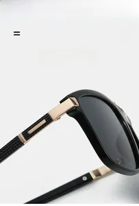 Close-up of premium metal hinge and gold temple accents on black ultra-light sunglasses