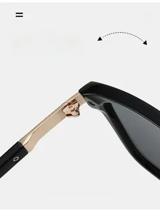 Macro detail of durable metal hinge on stylish sunglasses with black and gold finish