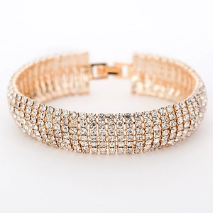 Detailed close-up of a five-row rhinestone bracelet with a rose gold folding clasp