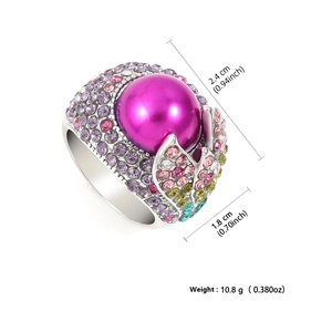 Bohemian style ring with large pink pearl and colorful rhinestones in a 45-degree angle view