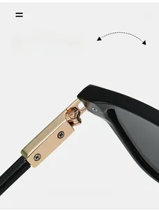 Détail de la charnière en métal doré durable sur les lunettes de soleil aviateur rétro