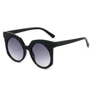 Fashionable oversized oval hip-hop sunglasses with black textured frame and gray gradient lens