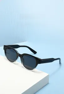 Detailed view of two-tone retro polygon sunglasses with black and grey gradient frame