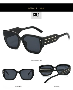 Three-view display of black cat-eye sunglasses with gold metal bars on temples