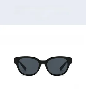 Front view of retro small polygonal sunglasses with thick black frames and grey lenses