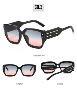 Three-view display of black cat-eye sunglasses with gradient lenses and gold temple accents
