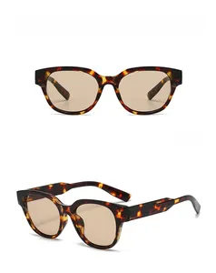 Close-up of tortoise shell polygon sunglasses with brown lenses from front and side angles