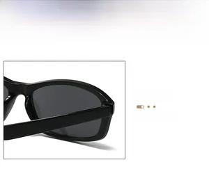 Detailed macro view showing the hinge and durable frame connection of black sunglasses