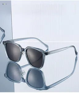 Close-up of light blue TR90 polarized sunglasses with metal hinge and grey gradient lens