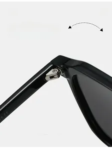 Detailed macro view of high-strength metal hinge on black TR90 polarized sunglasses