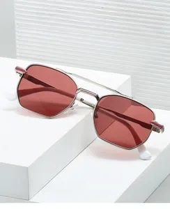 Detail of silver metal frame square sunglasses with red lenses and double bridge design